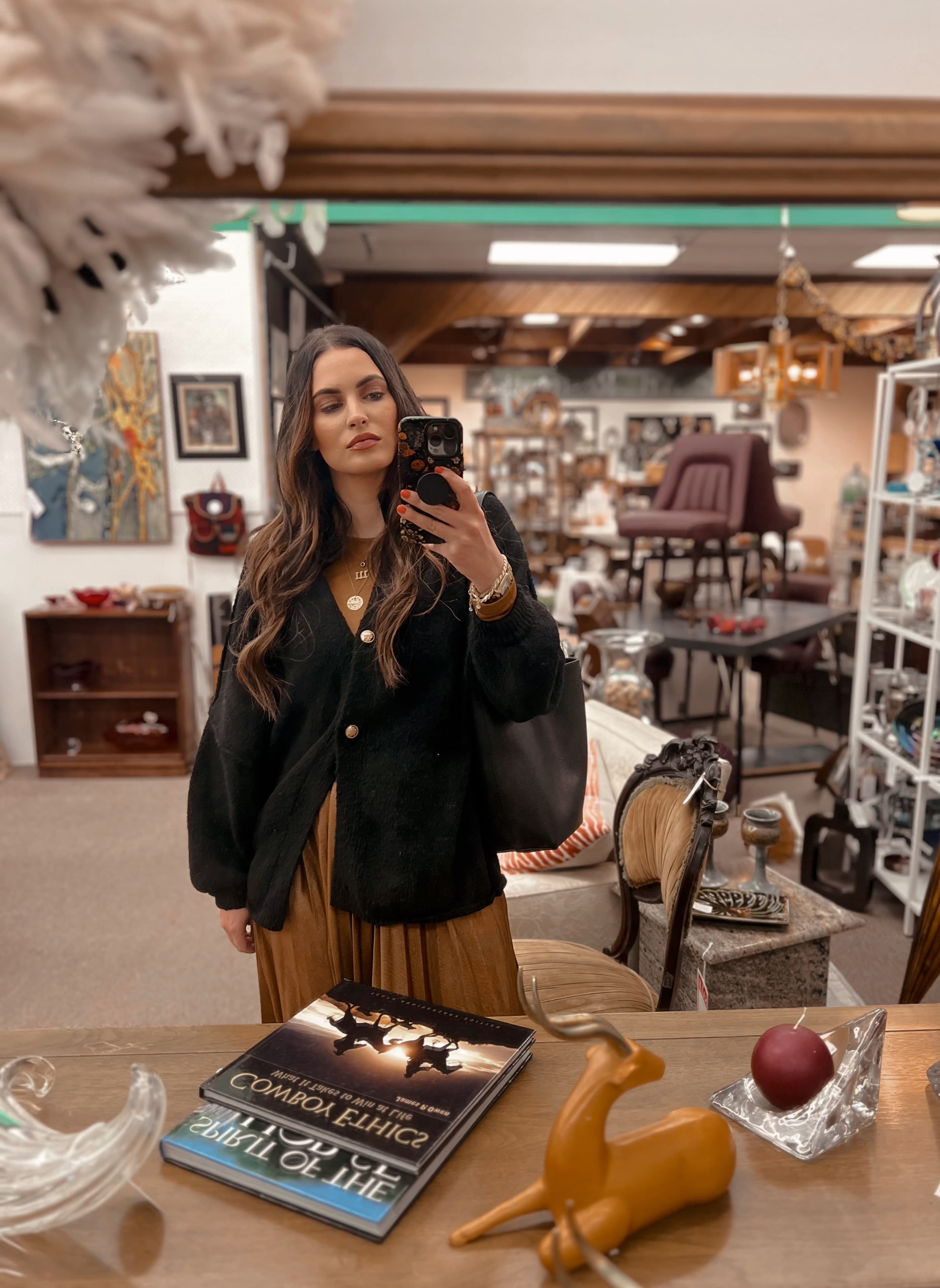 Ashley Faye finding vintage treasures in a Denver thrift shop